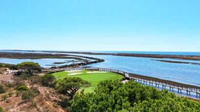 Spectacular view of the Atlantic Ocean and lush greenery along the coast, highlighting Portugal’s premium real estate locations in Algarve and Lisbon for luxury property investment.